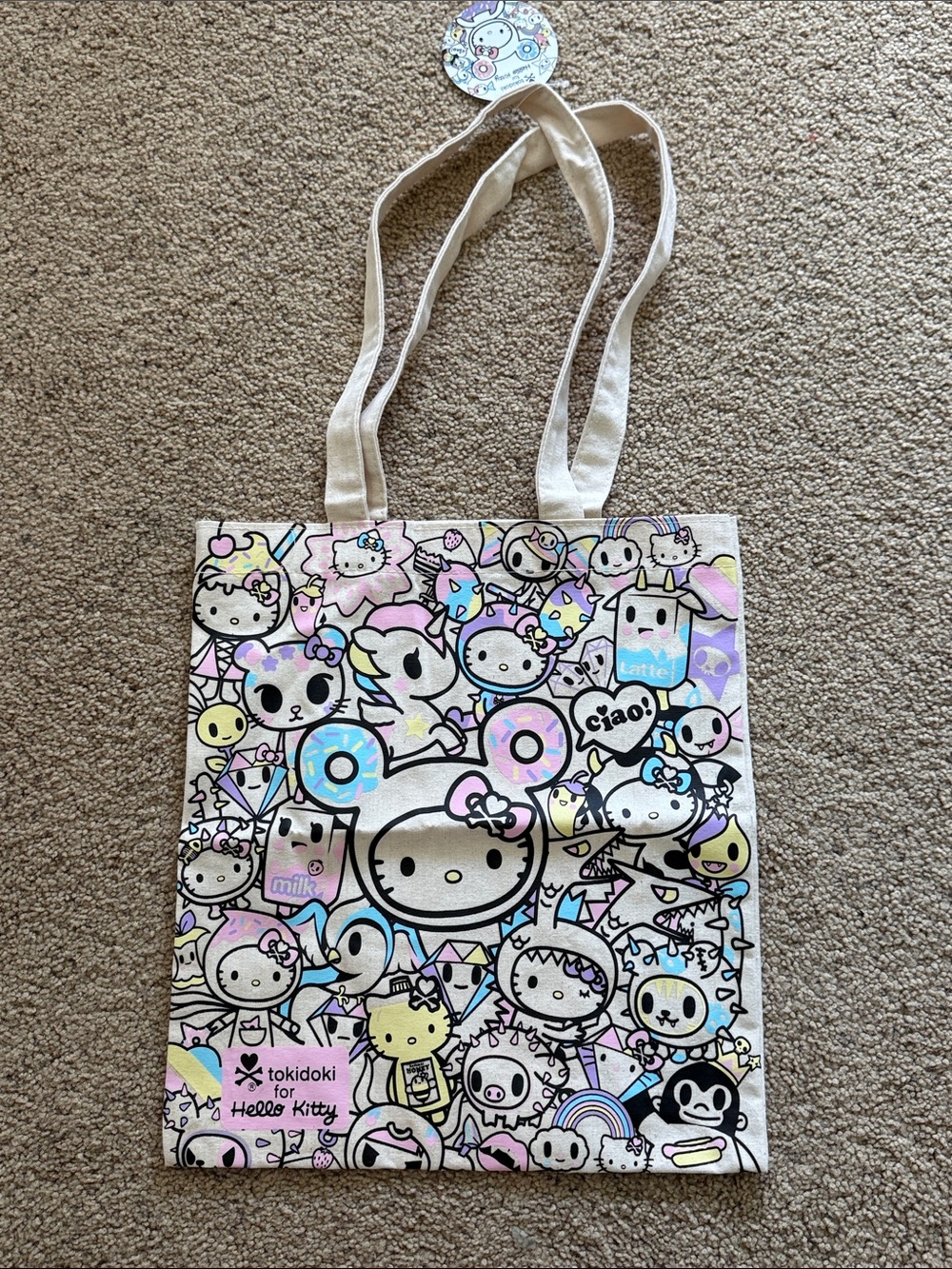 tokidoki pastel cream tote with pink, blue, yellow and purple character print